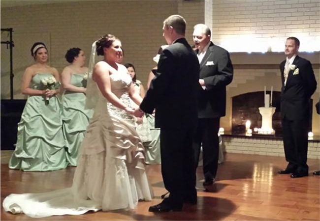 Abi and Brian exchanging vows