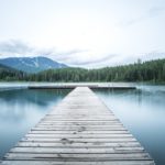 Dock, Still Lake - TJ Holowaychuk Unsplash